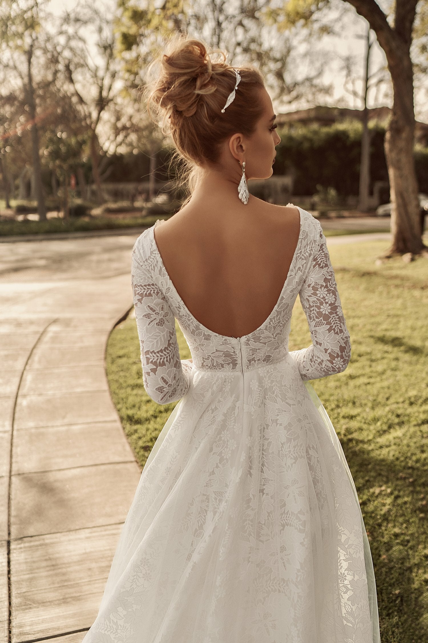 Model showing off the low back scoop of the Elly Bride Shirley