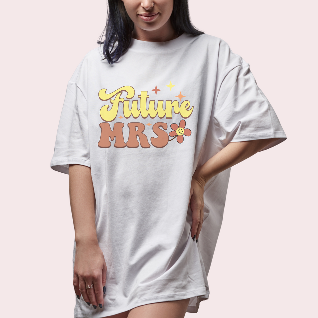 Young woman wearing t shirt with :"future mrs" printed in retro font