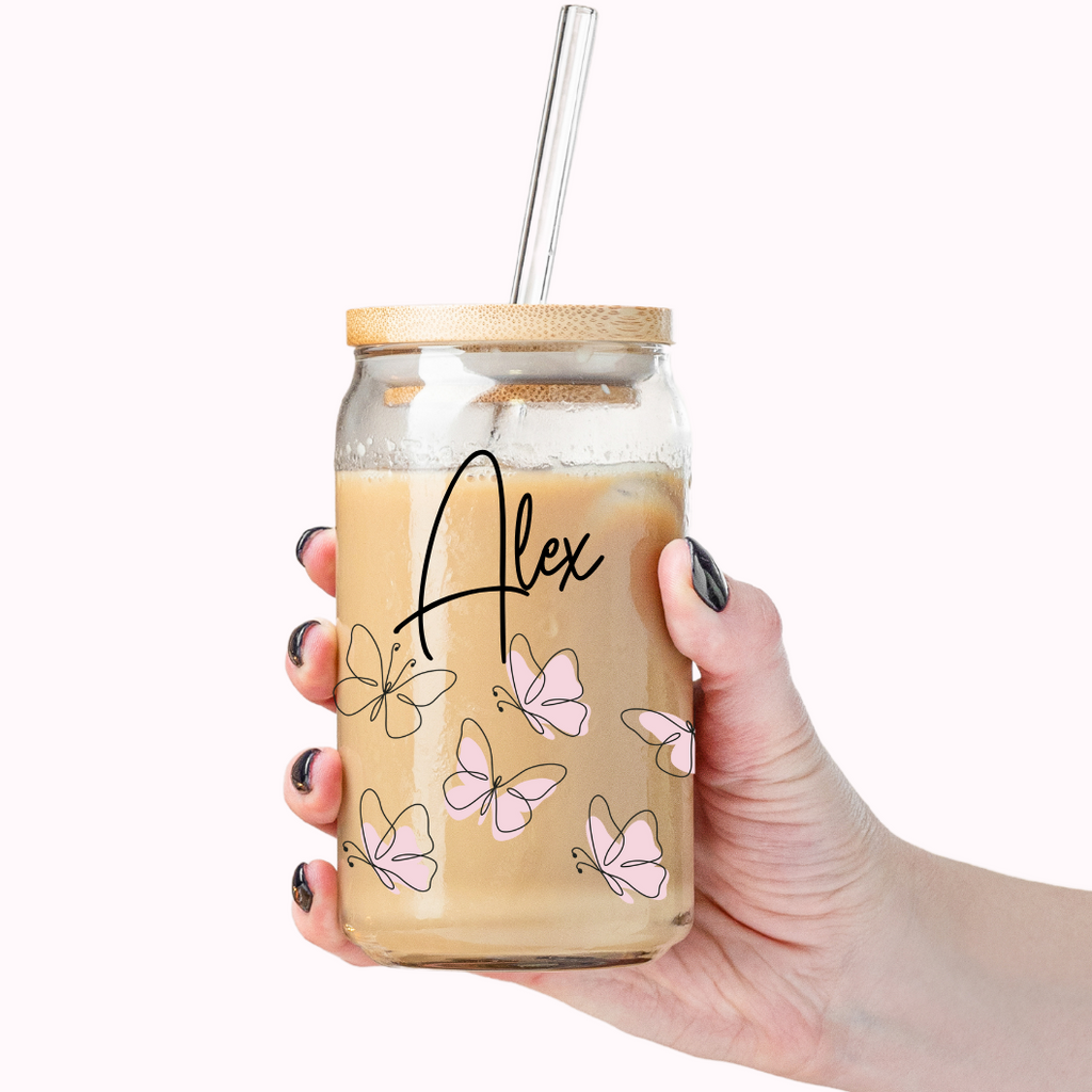Custom glass tumbler with "Alex" printer on the front along with pink butterflies. 