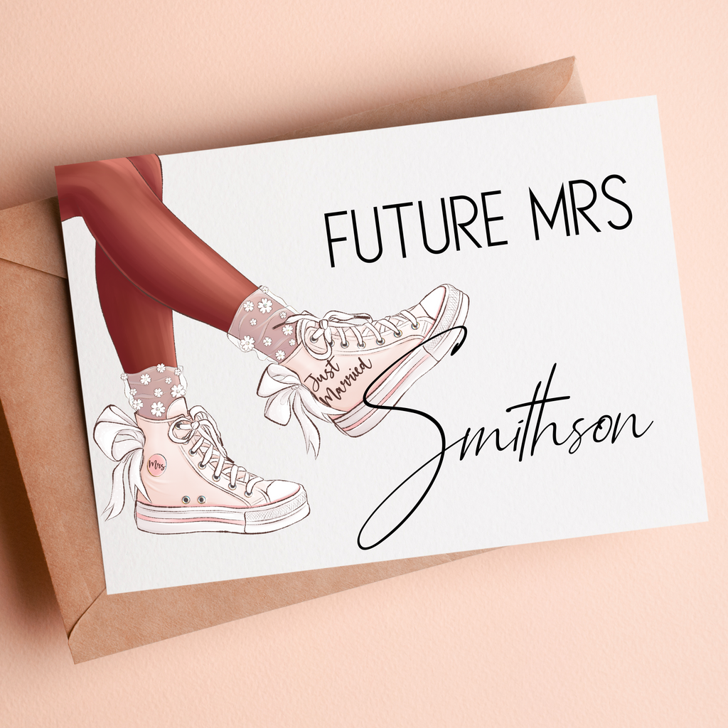 A custom "future mrs Greenberg" card with pink sneakers and "just married" featured on the side of the shoe. A great idea for the newlywed who's fun and unique.