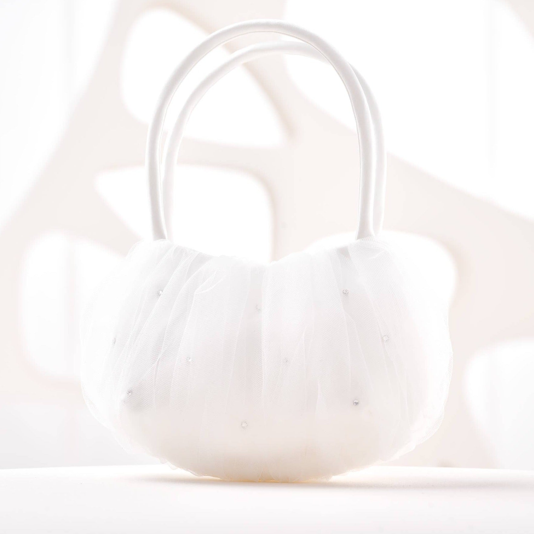 White sparkle tulle handbag with a rigid handle.