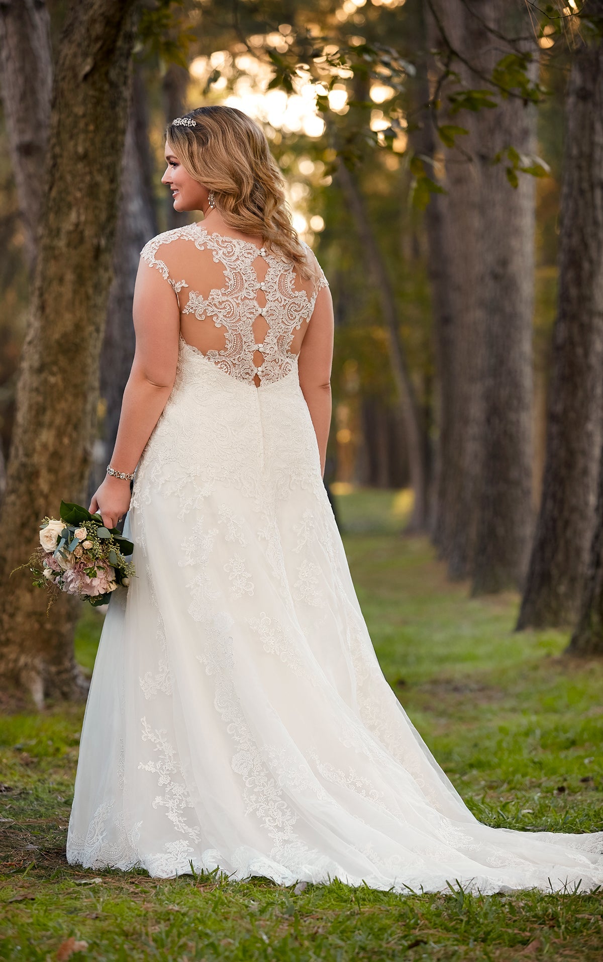 Ball gown wedding dress with lace and thick straps back view