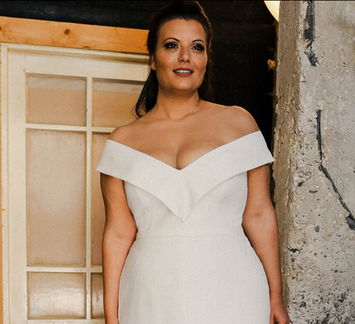 Closeup of model wearing Francis by Studio Levana ivory crepe dress