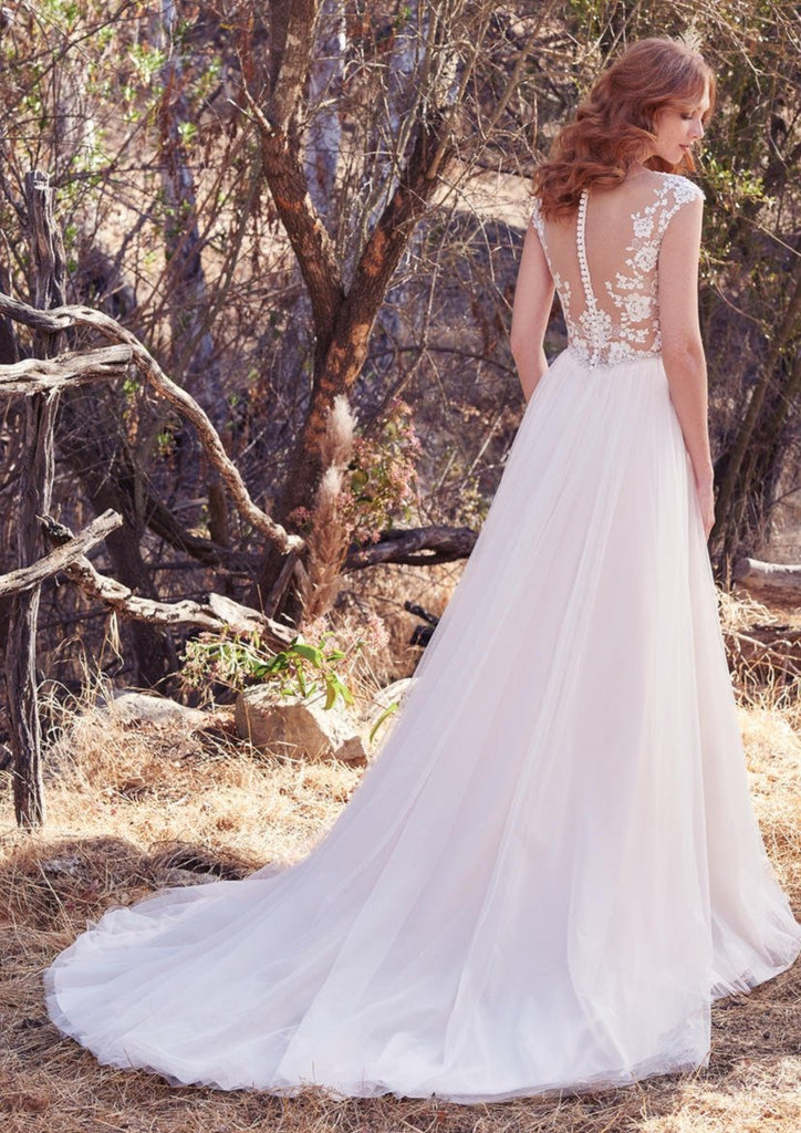 Back of the detailed Maggie Sottero SONJA wedding dress with detailed floral appliqe and delicate buttons