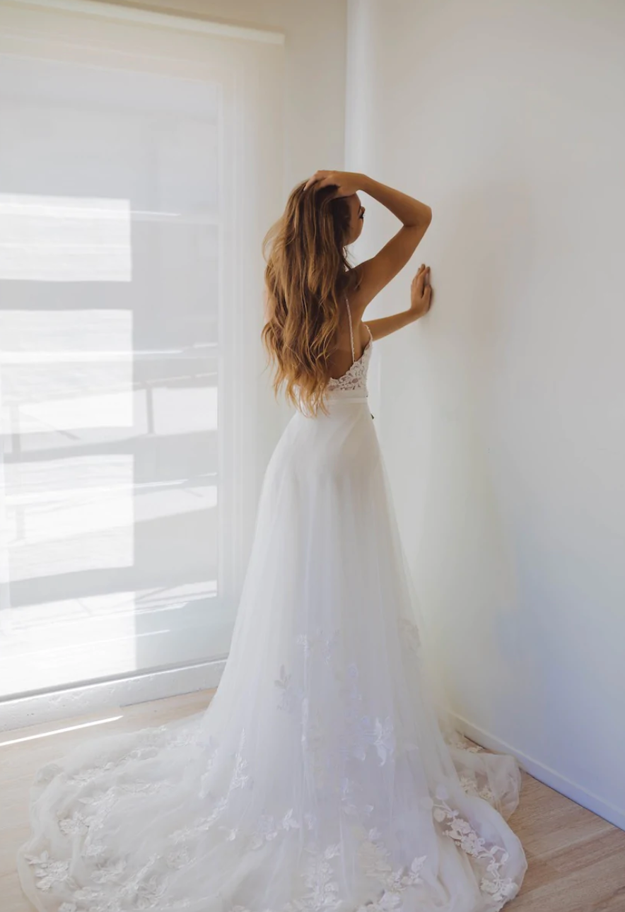 Model showing off the back of the overskirt by untamed petals