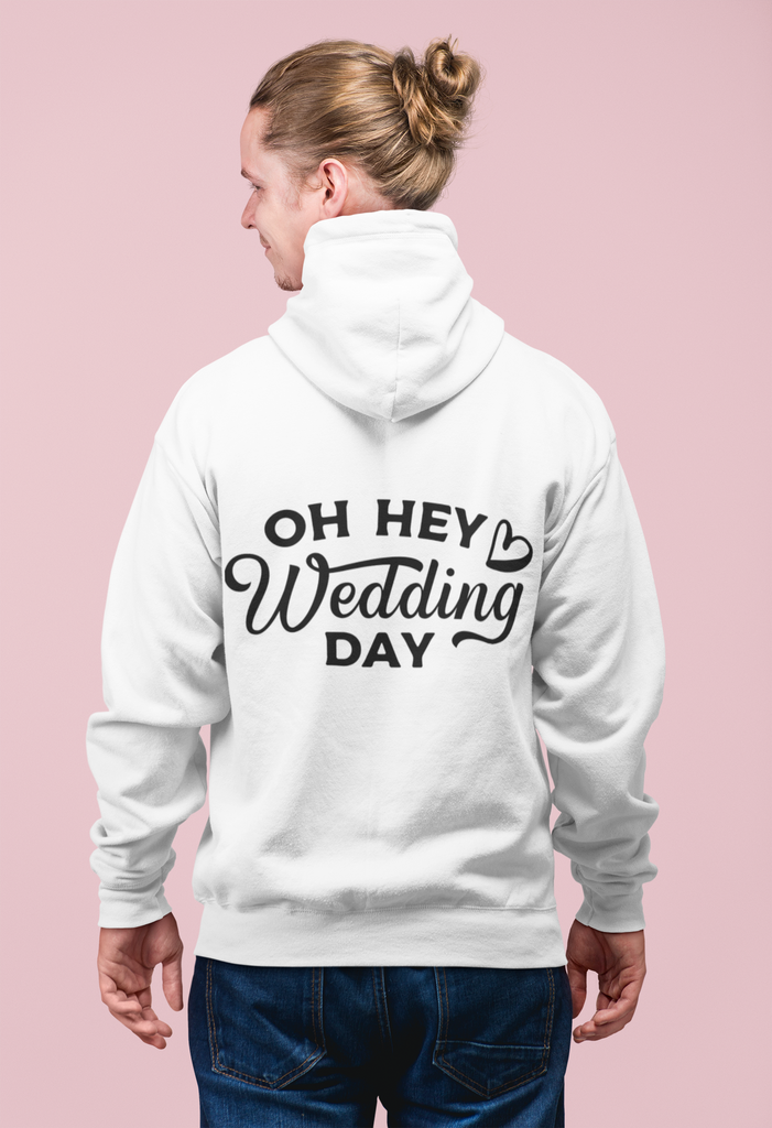 A back view of a white hoodie with "oh hey wedding day" printed in black