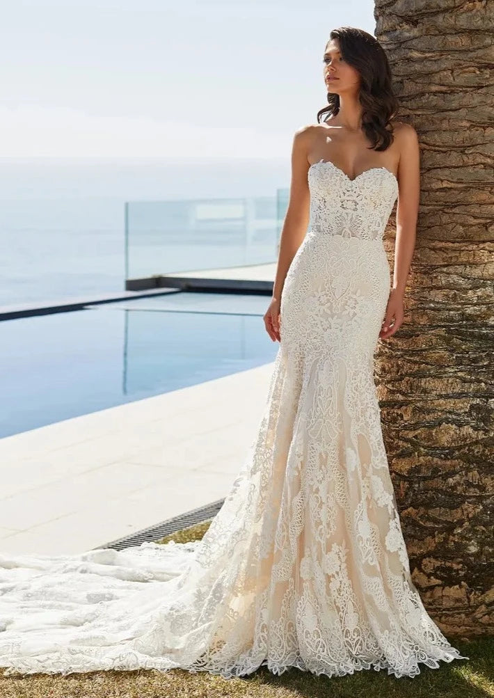 Full body front view of desi by pronovias