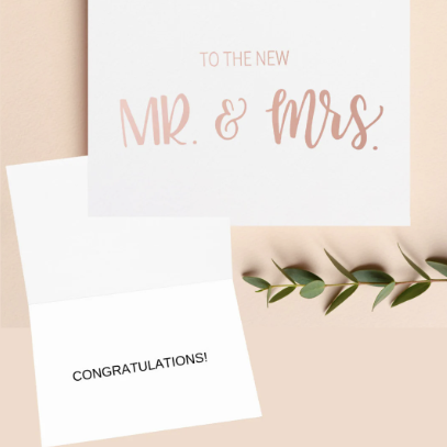 To the new mr and mrs card, outside of the card in rose gold, inside of the card "congratulations"