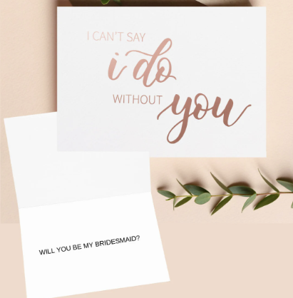 Outside of Bridesmaid Card "I can't say I do without you" in rose gold foil, on the inside of the card "Will you be my Bridesmaid?"